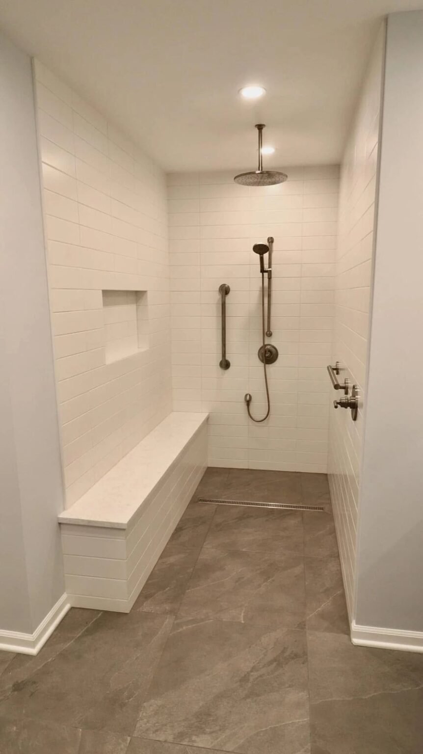 Curbless walk-in shower with a full-length bench, linear drain and a hand-held shower on a slide bar, Mesa, AZ